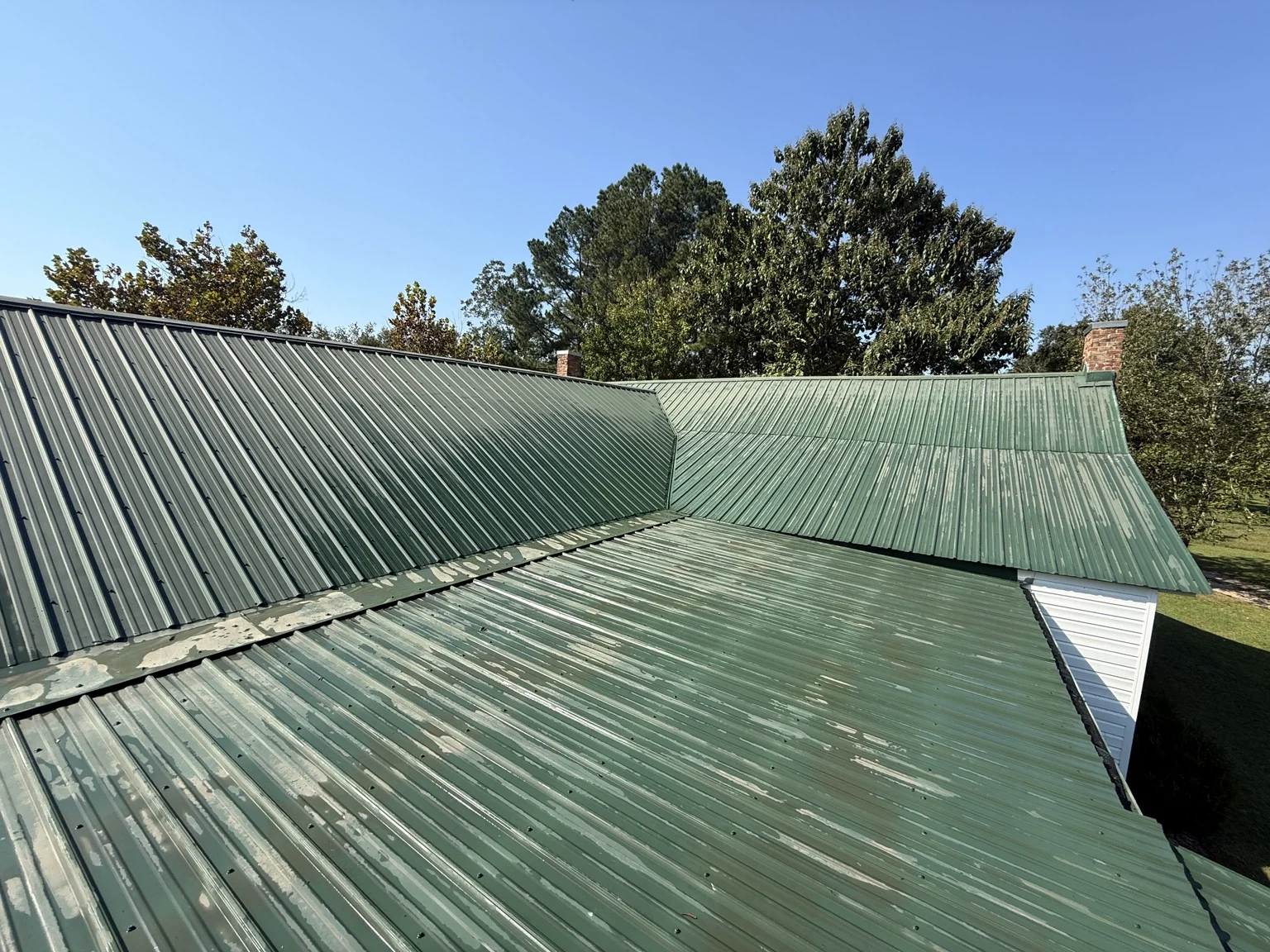 Before — weathered metal roofing